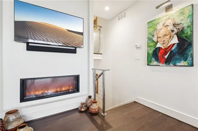 a room with painting on the wall and a painting on the wall