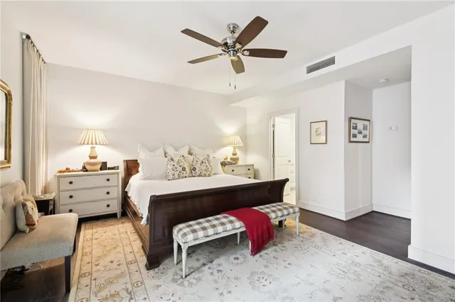 a bed room with furniture and wooden floor