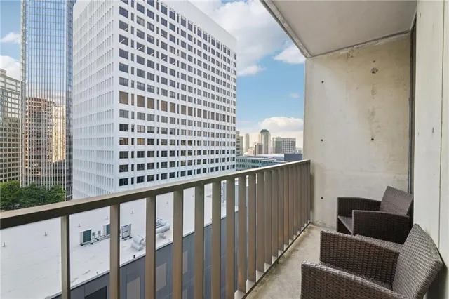 a view of balcony with furniture