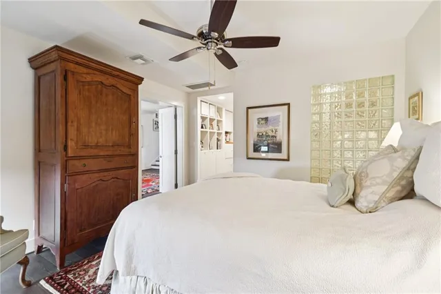 a bedroom with a bed and a dresser