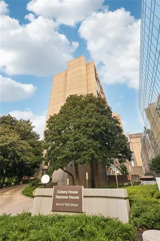 a room with a table chairs and projector view