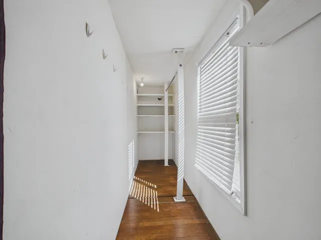 a bathroom with a bathtub and a window