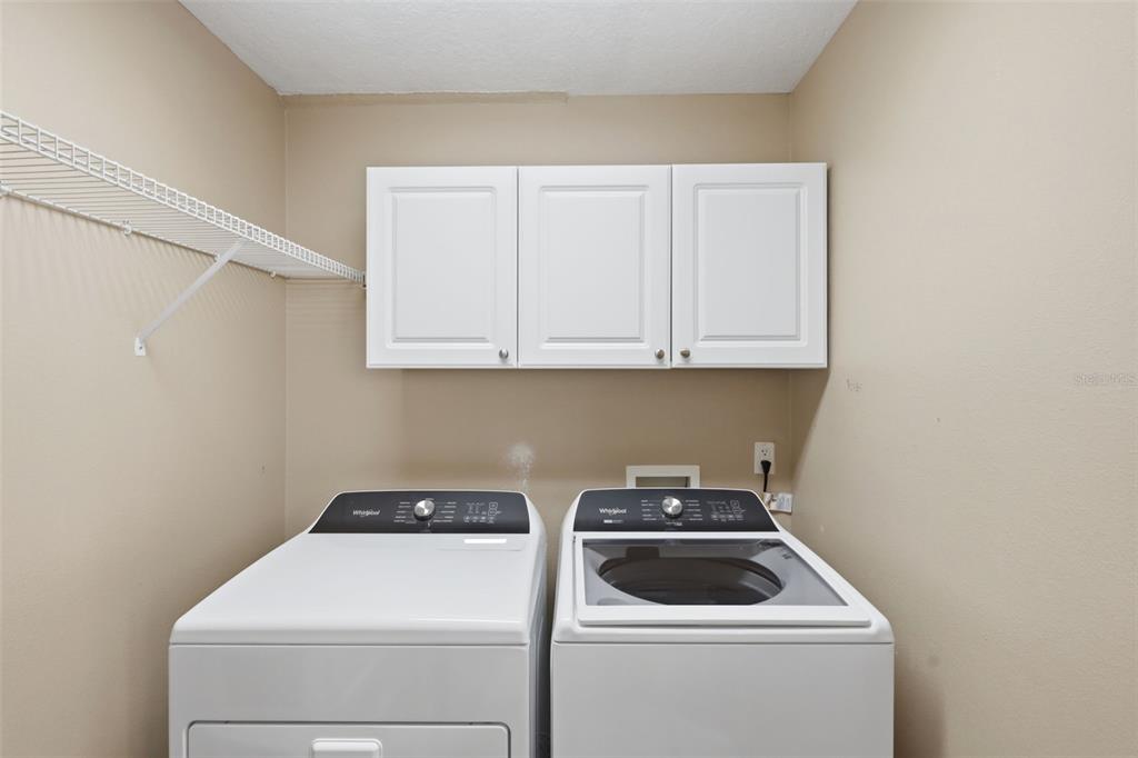 907 Pawstand Road Celebration, FL 34747 - Photo 35 of 49 a room with storage and utility
