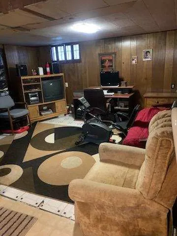 a room with furniture and a flat screen tv