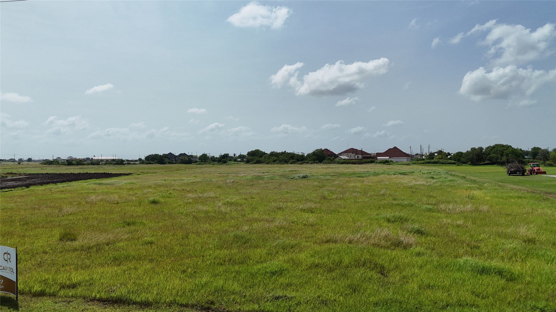 305 Bayshore Road Palacios, TX 77465 - Photo 21 of 25 A spacious, verdant lot awaits your vision, bordered by residential development.