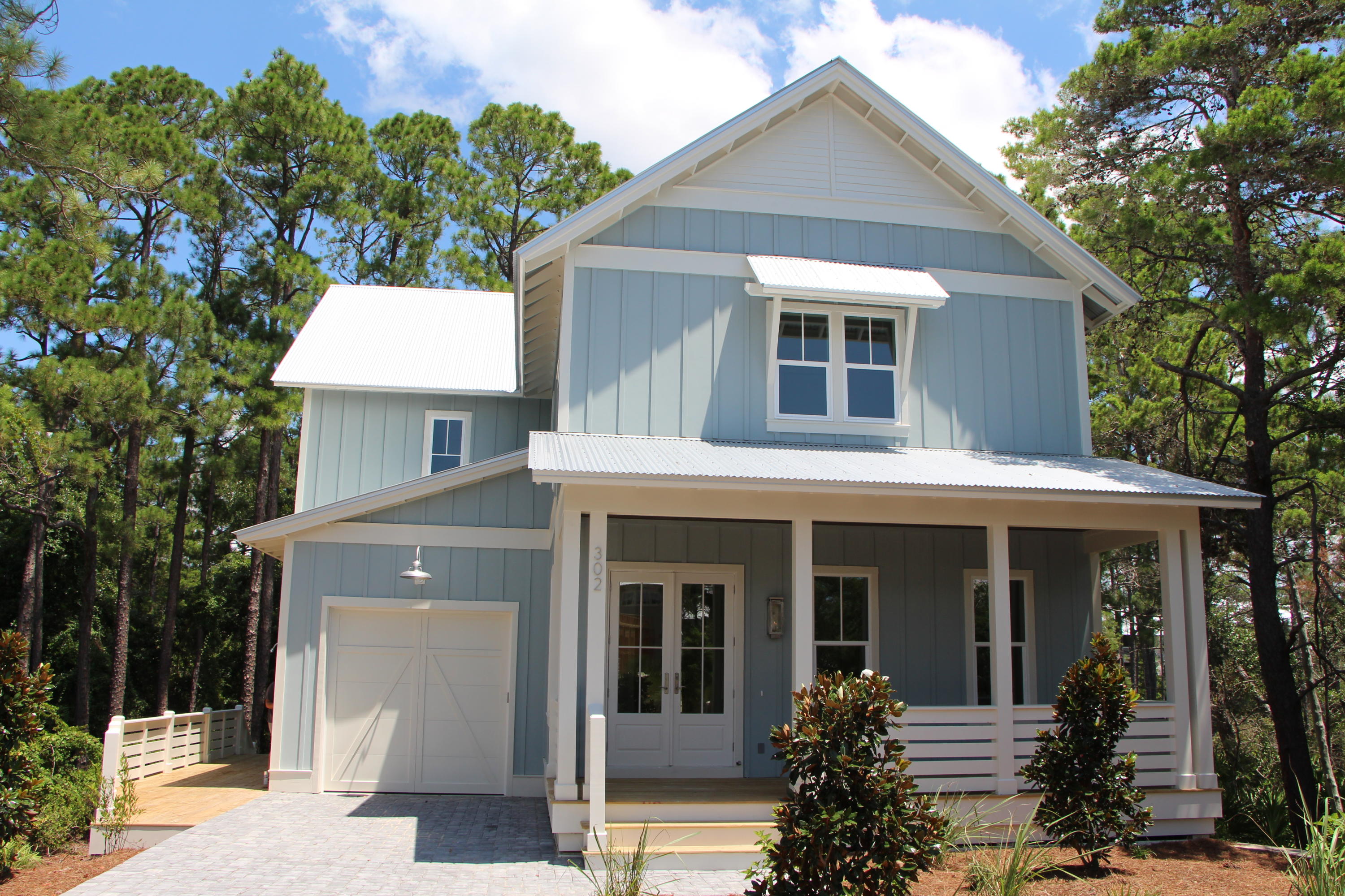 302 Cabana Trail Santa Rosa Beach, FL 32459 - Photo 1 of 8 a front view of a house with garden