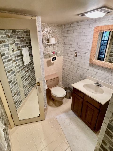 511 1/2 1/2 Ridge Road Wilmette, IL 60091 - Photo 16 of 20 a bathroom with a sink toilet and shower