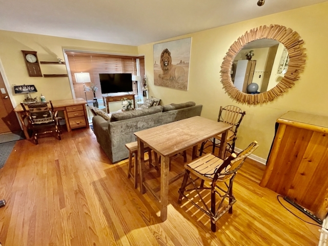 511 1/2 1/2 Ridge Road Wilmette, IL 60091 - Photo 7 of 20 a view of a dining room with furniture and wooden floor