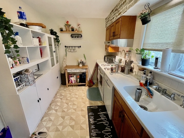 511 1/2 1/2 Ridge Road Wilmette, IL 60091 - Photo 9 of 20 a kitchen with a sink stove and cabinets