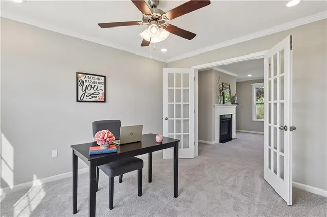 a view of a livingroom with furniture and a window