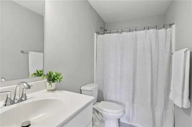 a bathroom with a sink and toilet