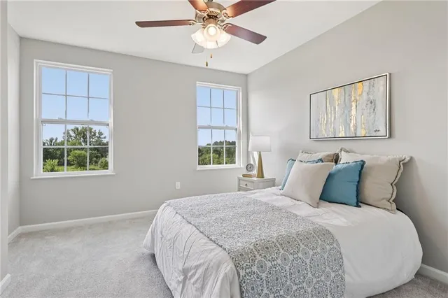 a bedroom with a bed and window