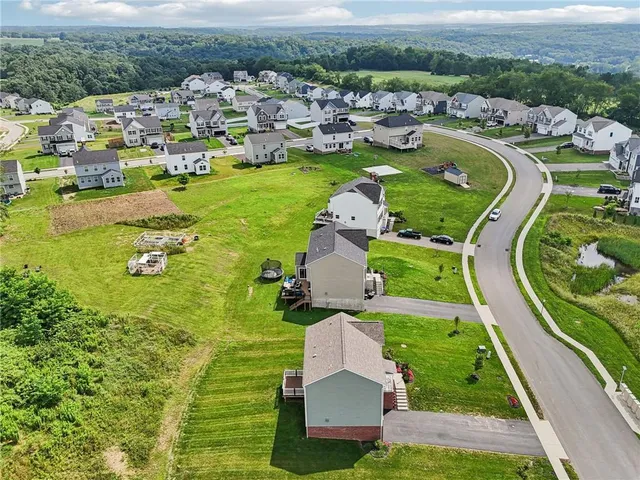 an aerial view of a house with outdoor space lake view
