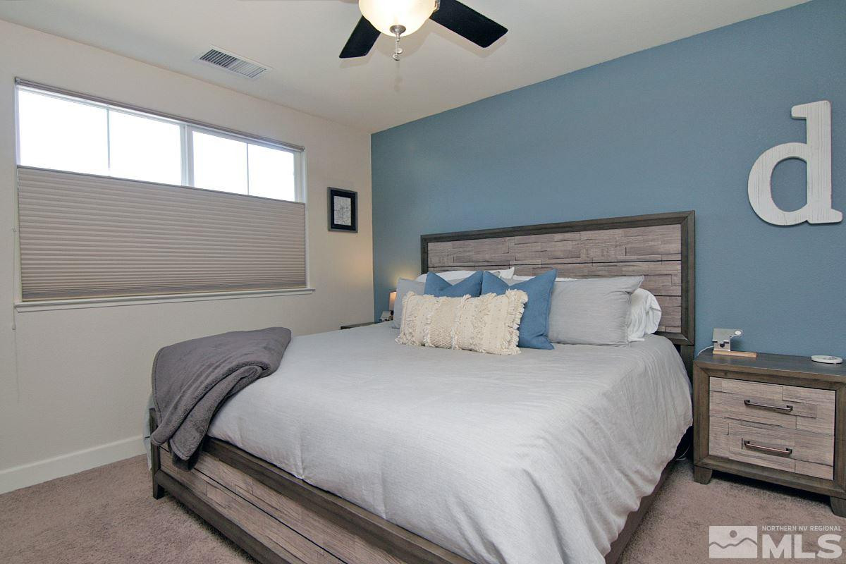 1910 Bears Ranch Drive Reno, NV 89521 - Photo 12 of 20 a bedroom with bed and window