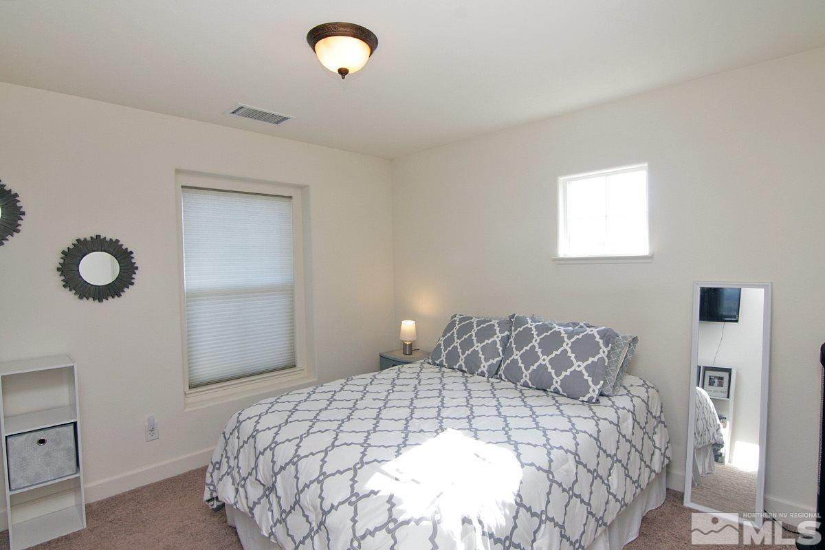 1910 Bears Ranch Drive Reno, NV 89521 - Photo 14 of 20 a bedroom with a bed and window