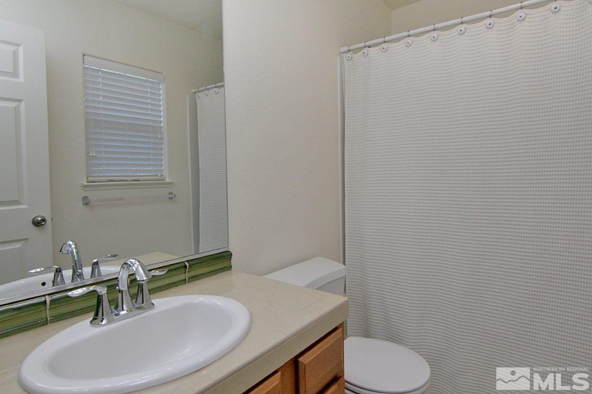 1910 Bears Ranch Drive Reno, NV 89521 - Photo 15 of 20 a bathroom with a sink toilet and mirror