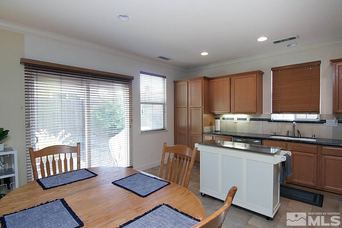1910 Bears Ranch Drive Reno, NV 89521 - Photo 6 of 20 a kitchen with stainless steel appliances granite countertop a stove a sink and a microwave