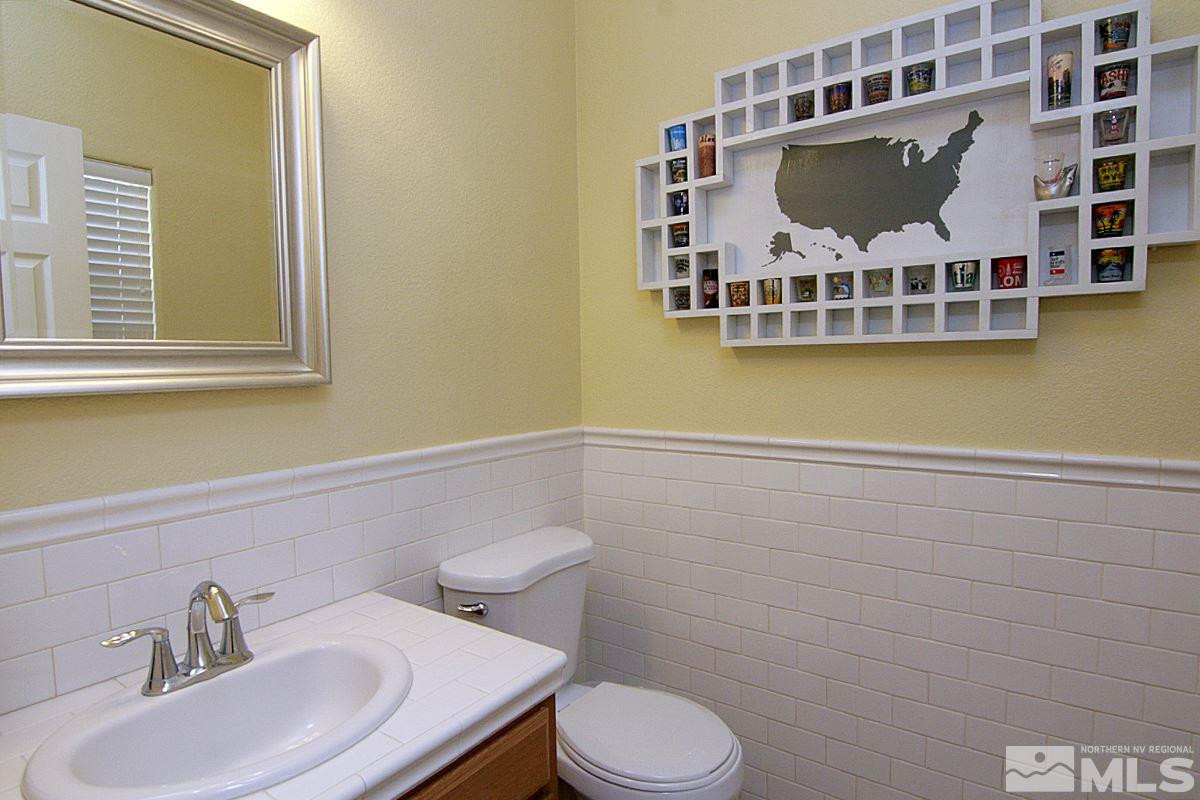 1910 Bears Ranch Drive Reno, NV 89521 - Photo 10 of 20 a bathroom with a toilet sink and mirror