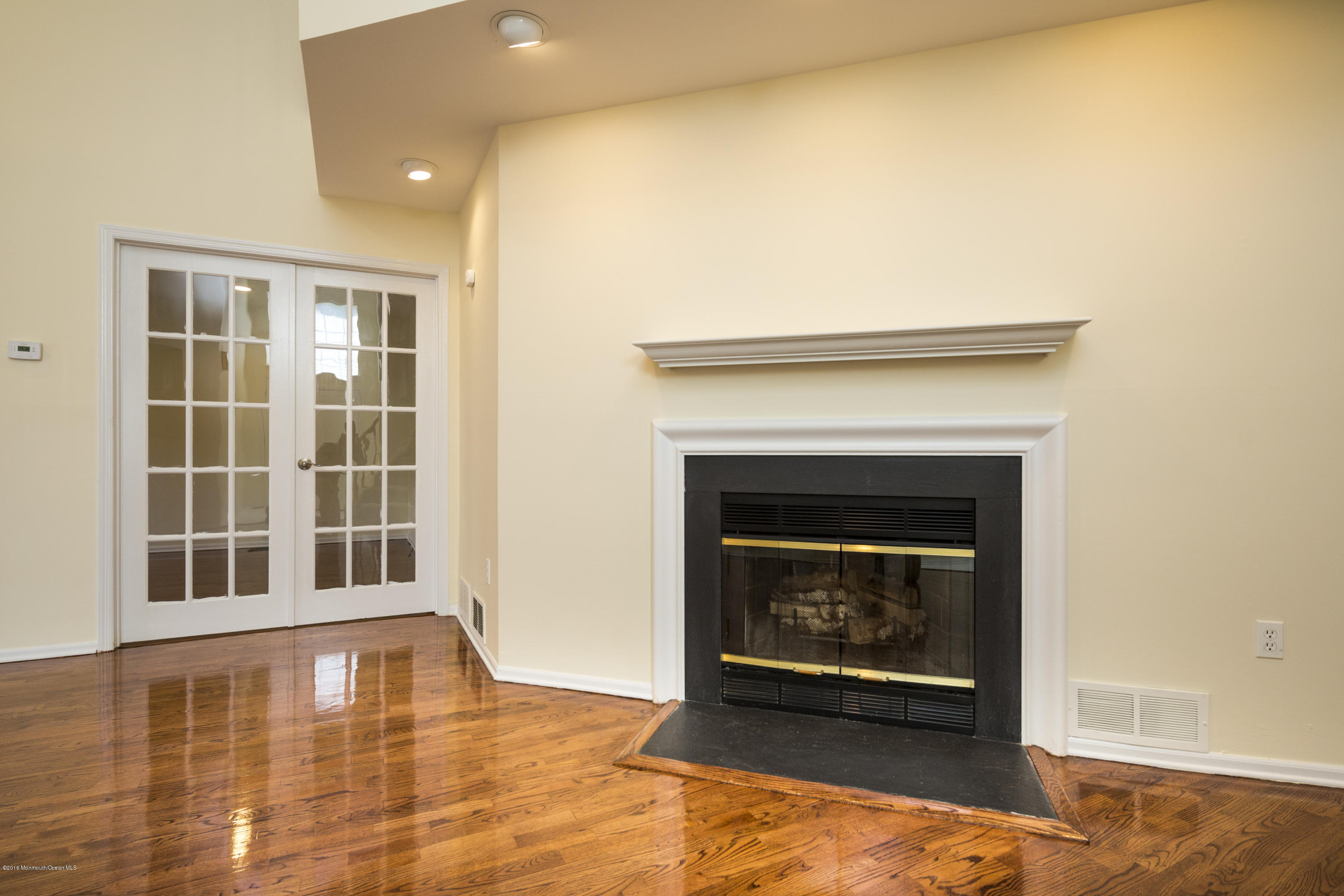 129 Racquet Road Wall, NJ 07719 - Photo 8 of 33 a view of an empty room with window and fire place