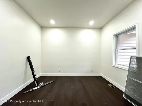 a view of a room with windows