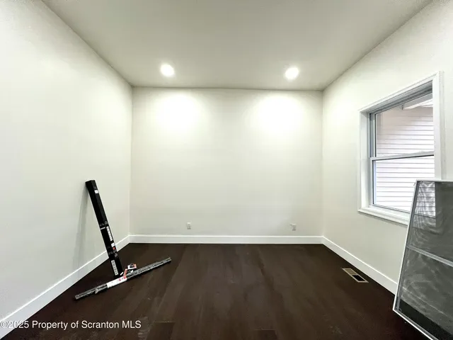 a view of a room with windows