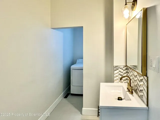 a bathroom with a bathtub and sink