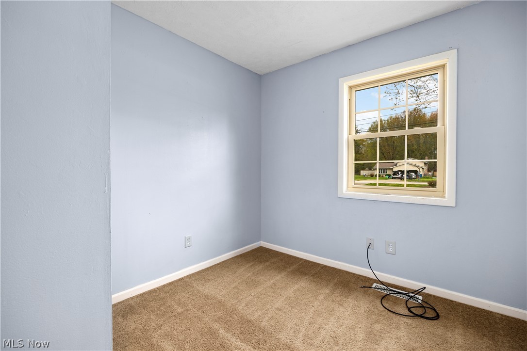 34067 Bainbridge Road North Ridgeville, OH 44039 - Photo 28 of 33 View of carpeted empty room