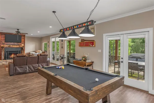 a living room with furniture a table and a large window