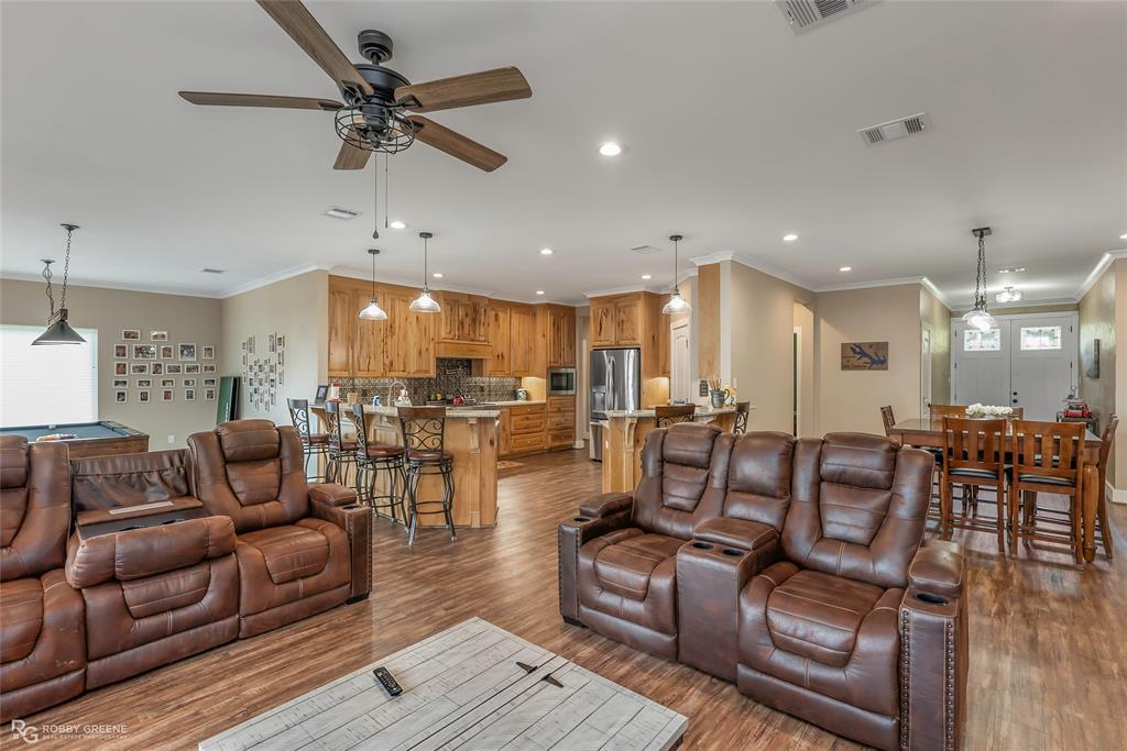 1072 Featherston Road Homer, LA 71040 - Photo 22 of 40 a living room with furniture kitchen view and a chandelier