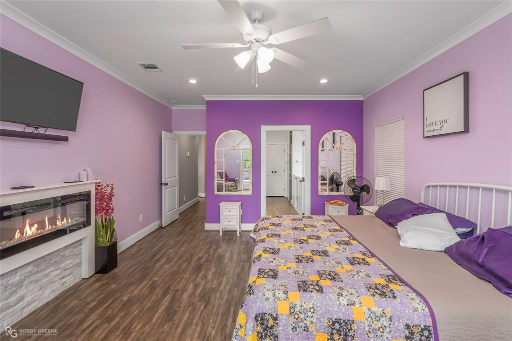 1072 Featherston Road Homer, LA 71040 - Photo 26 of 40 a bedroom with a bed and a flat screen tv