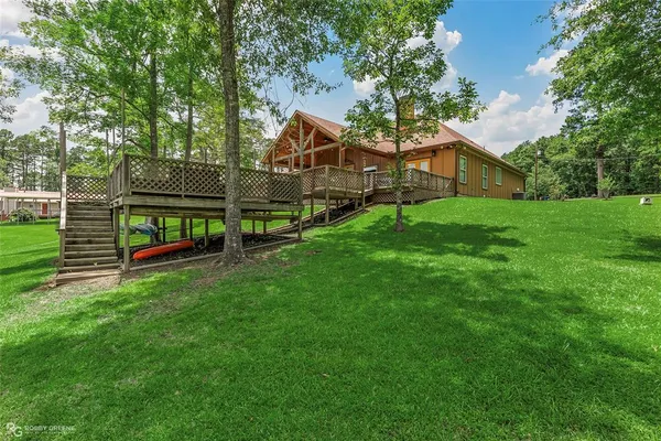 a view of a house with a back yard