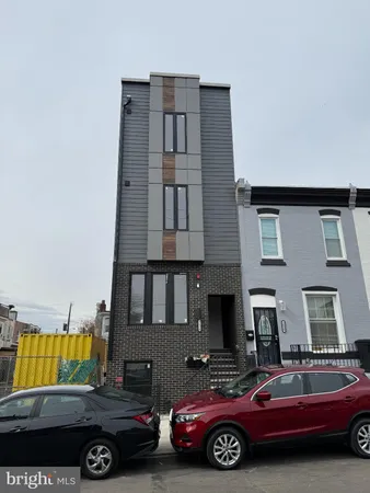 a front view of a house with parking space