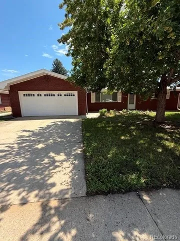 a view of a tree with a house