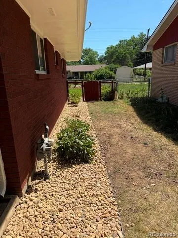 a backyard of a house with lots of green space