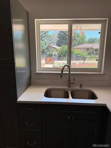 a kitchen with a sink and a window