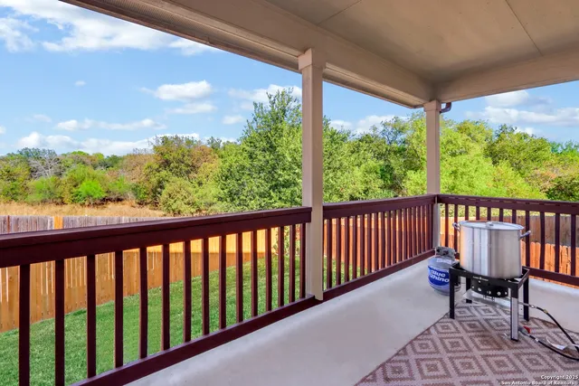 a view of a two chairs in the balcony