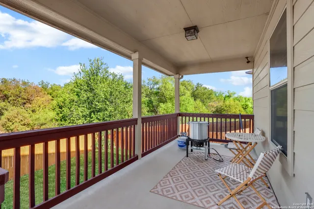 a view of a chair and table in the balcony
