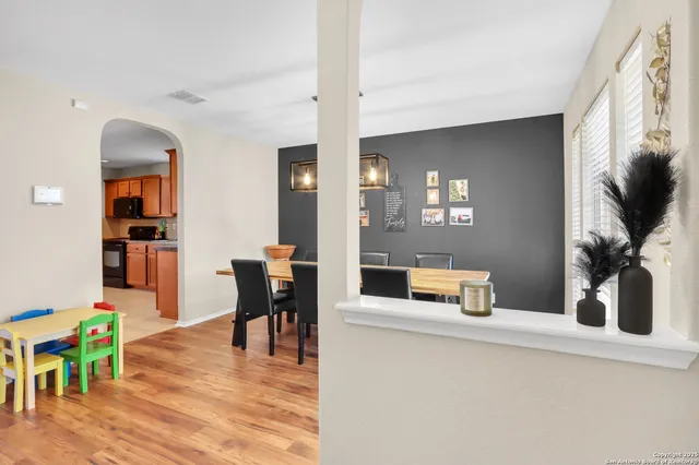a kitchen island with chair and wooden floor