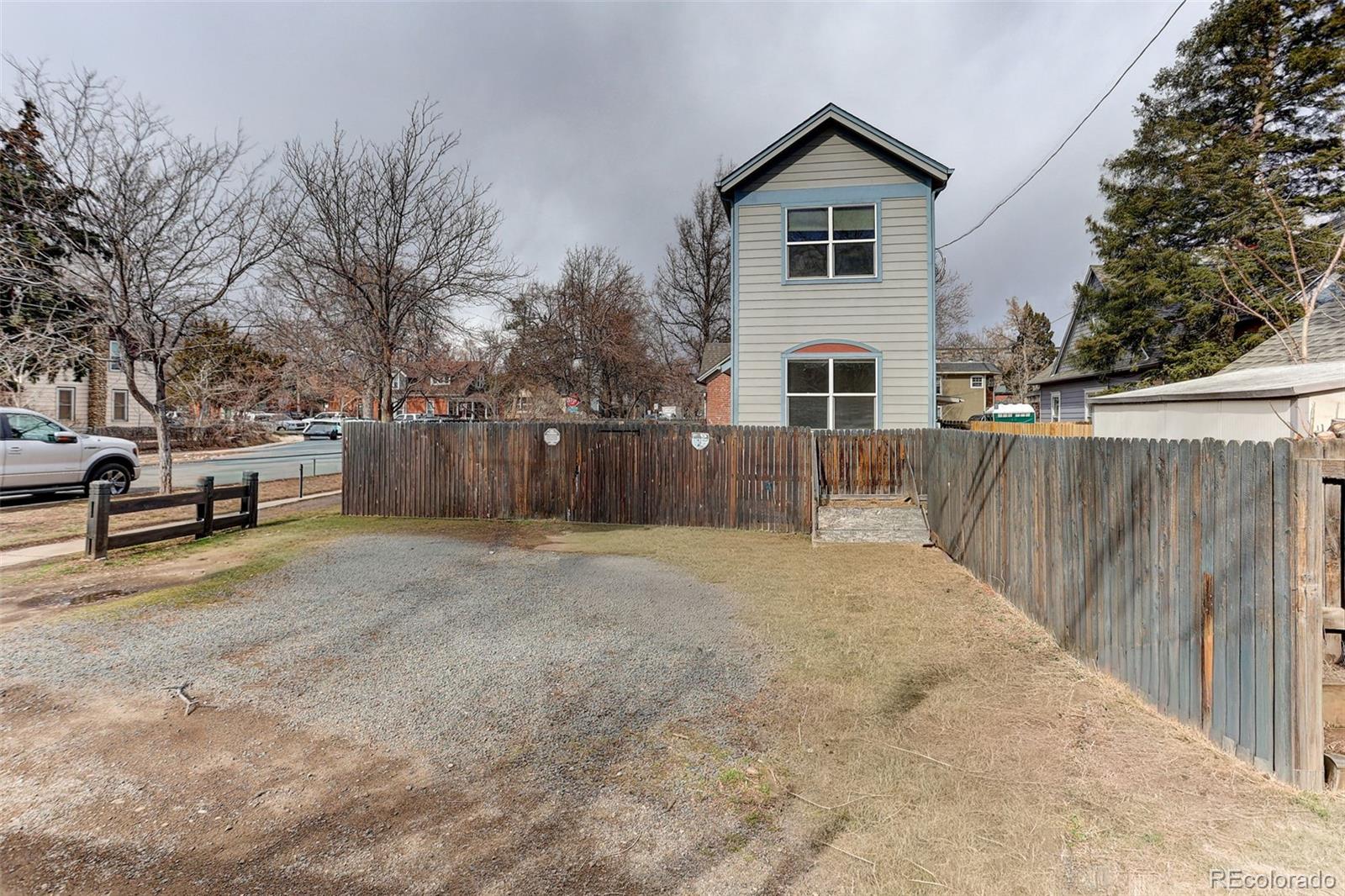 1902 Grove Street Boulder, CO 80302 - Photo 35 of 38 a view of a house with a yard covered in snow