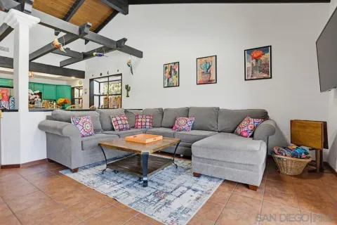 a living room with furniture and a rug