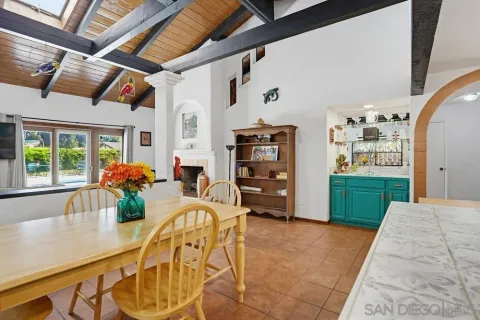 a living room filled with furniture and a large window