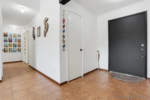 a view of a livingroom with a hall and entryway