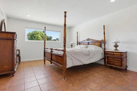 a bed room with a bed and a dresser