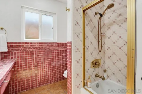 a bathroom with a shower and a shower
