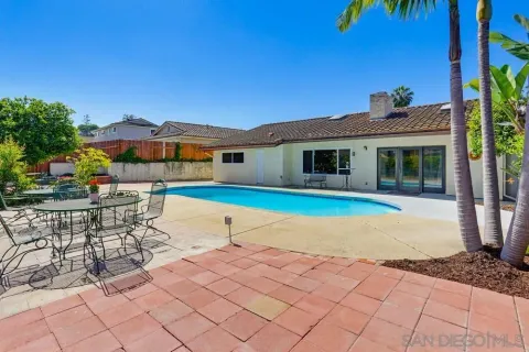 a view of pool with outdoor seating