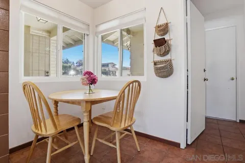 a dining room with furniture and window