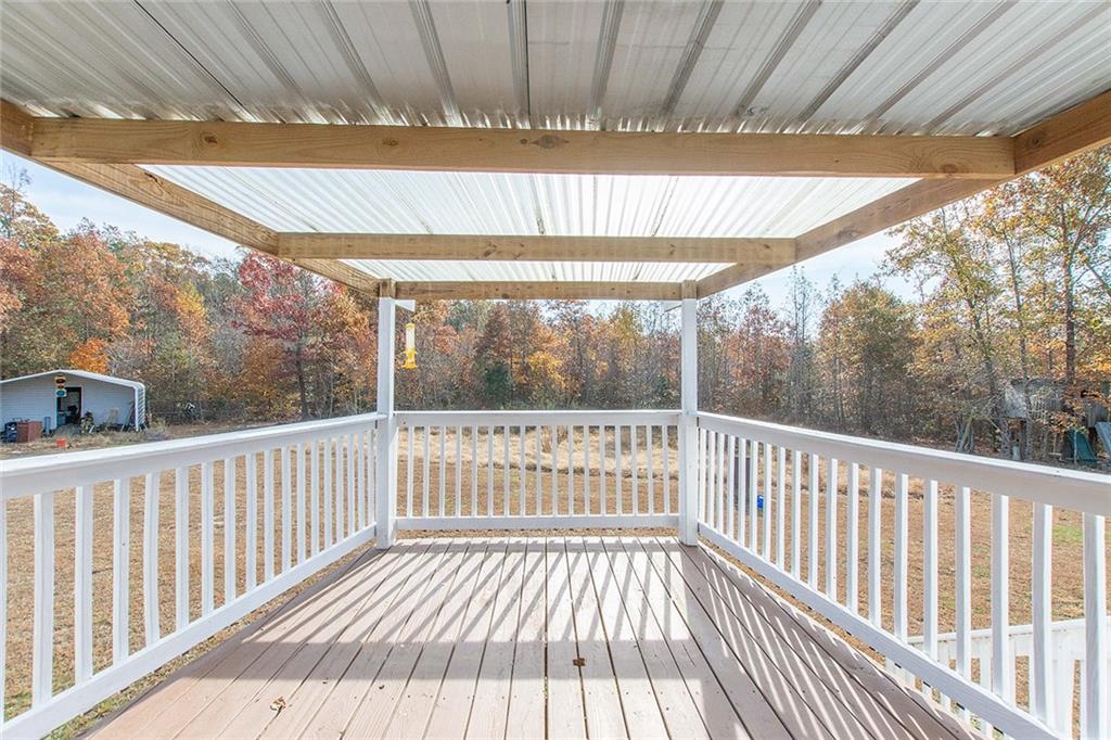 9481 Sturgeon Point Road Charles City, VA 23030 - Photo 17 of 44 a view of a porch with wooden floor