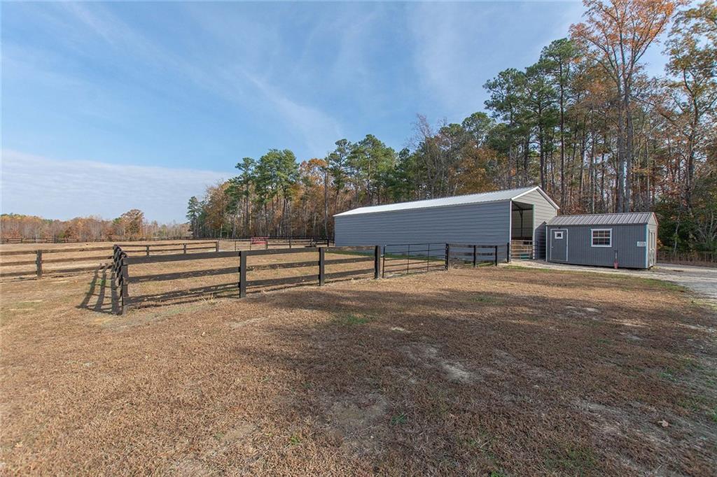 9481 Sturgeon Point Road Charles City, VA 23030 - Photo 20 of 44 a view of a house with a yard and sitting area