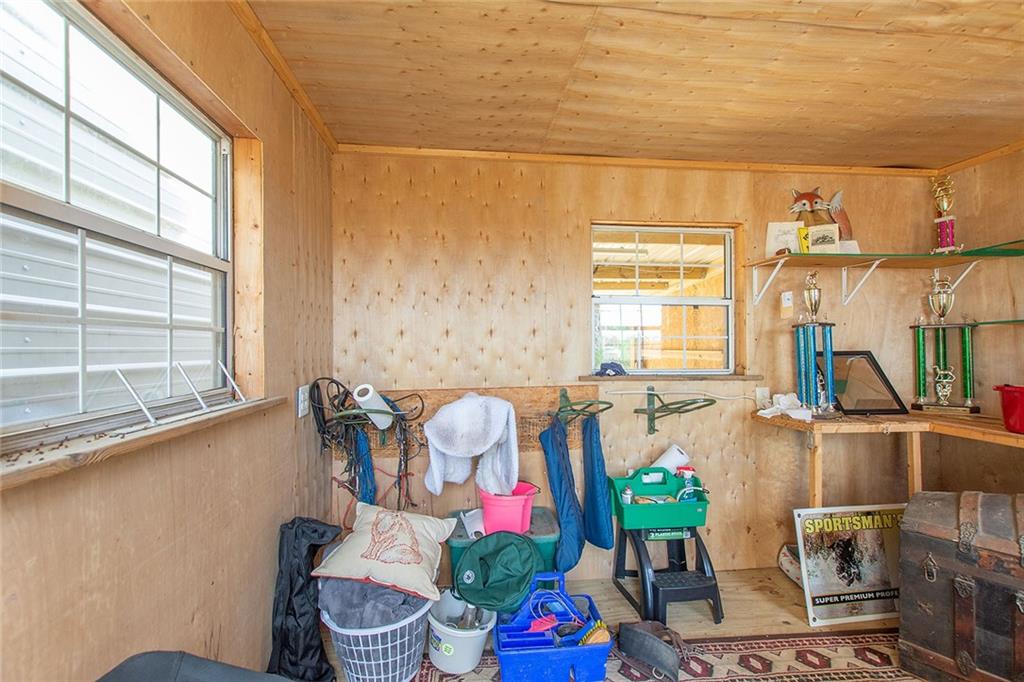 9481 Sturgeon Point Road Charles City, VA 23030 - Photo 28 of 44 a living room with furniture and floor to ceiling windows