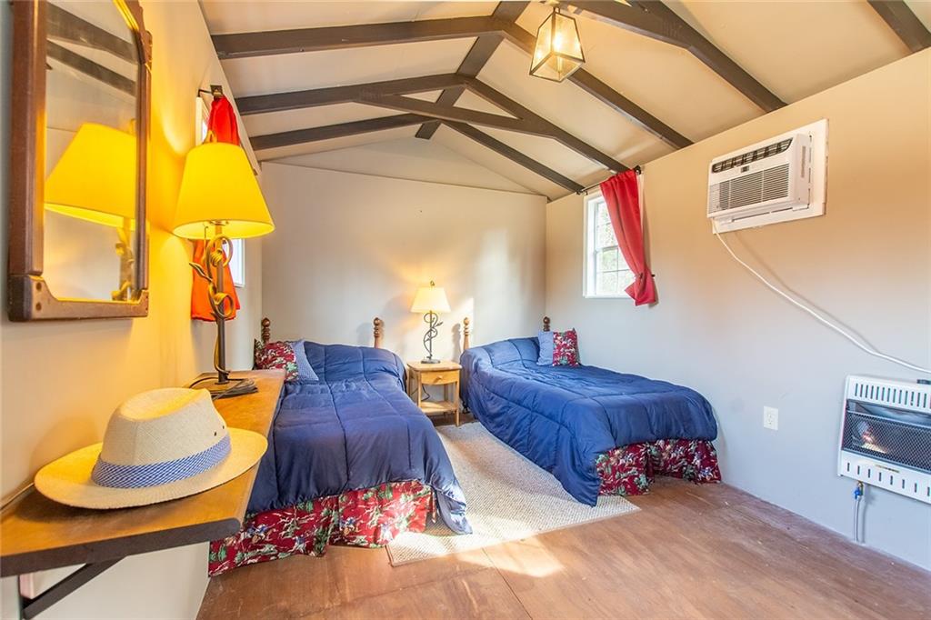 9481 Sturgeon Point Road Charles City, VA 23030 - Photo 35 of 44 a living room with furniture and a table